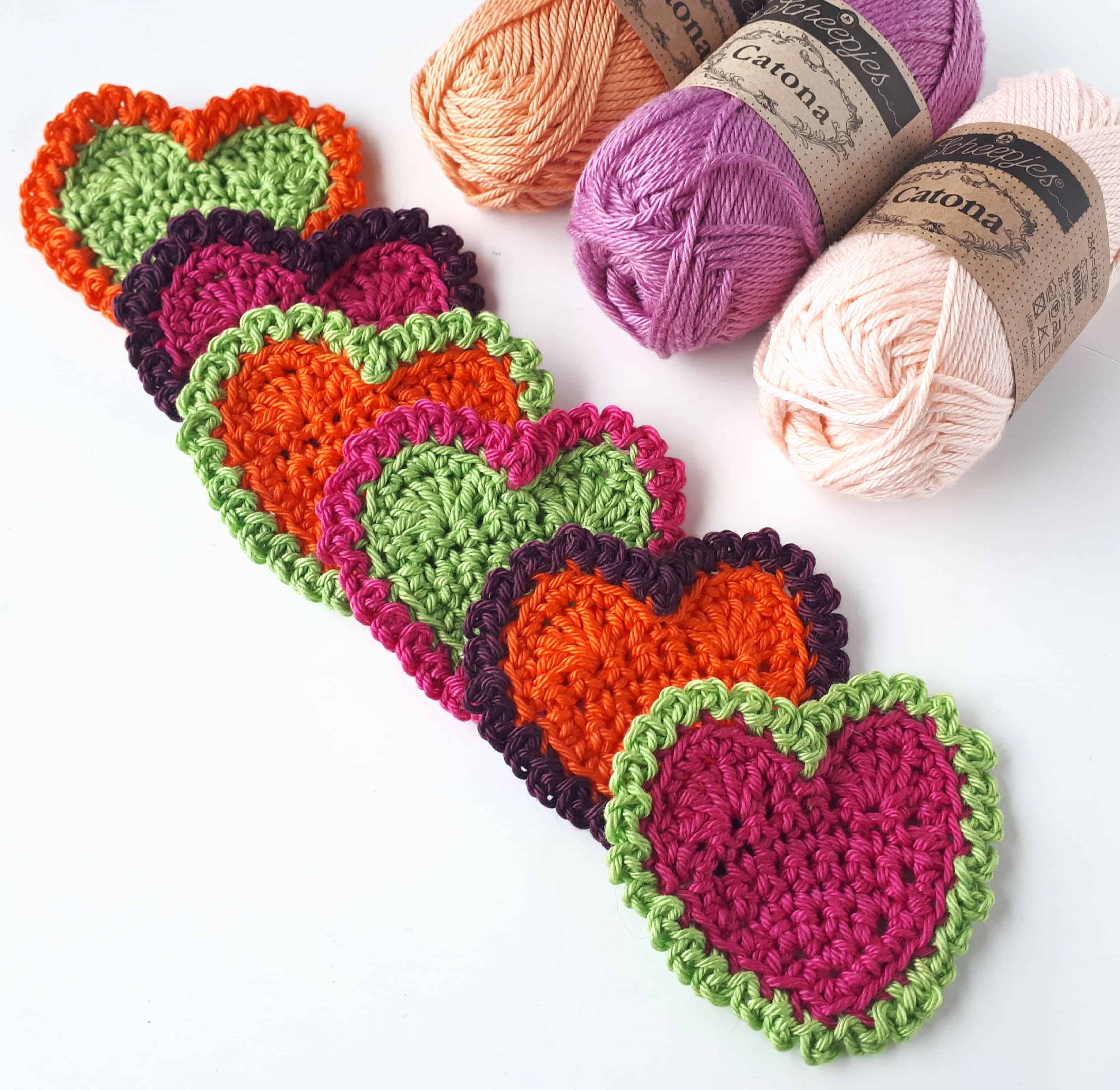 crochet hearts and balls of yarn