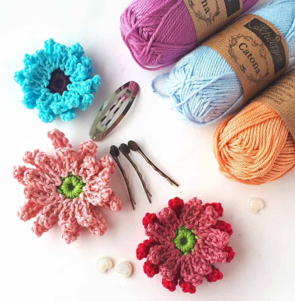 crochet flowers, yarn and clips