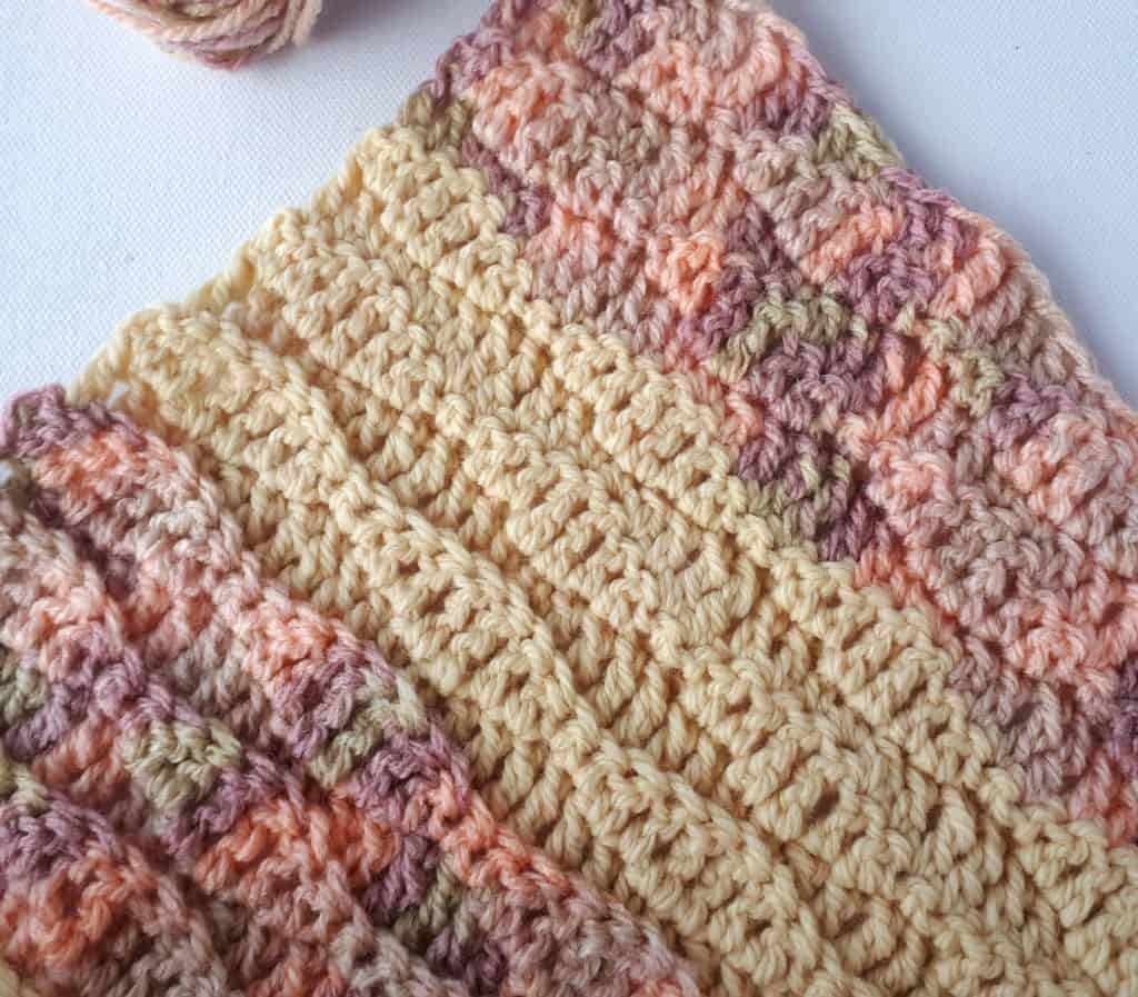 close up of a crochet wave stitch baby blanket