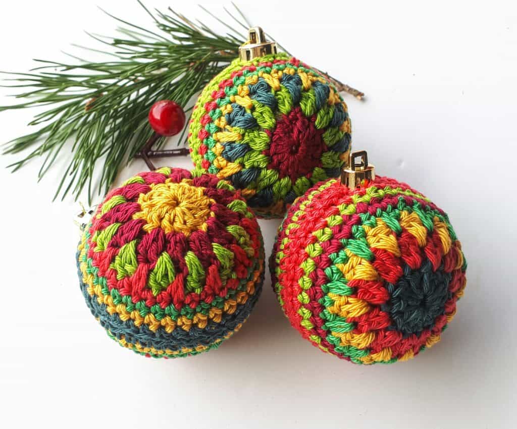 crochet christmas bauble in festive colours