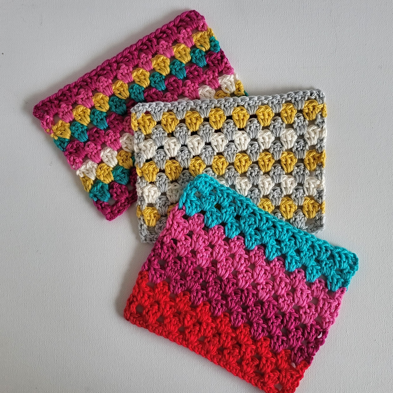 3 crochet pieces in multiple colors using the granny stitch