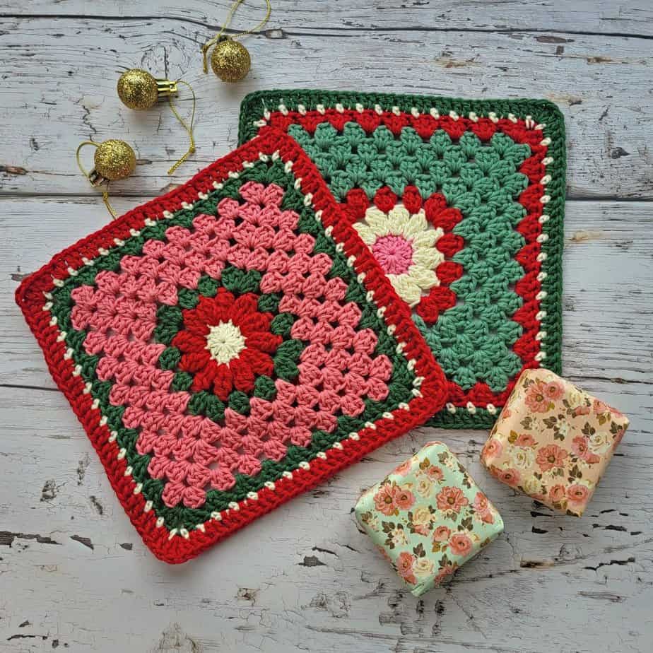 2 crochet christmas dishcloths and some soap on a wooden background