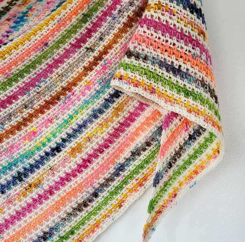 close up of a crochet stripe shawl 