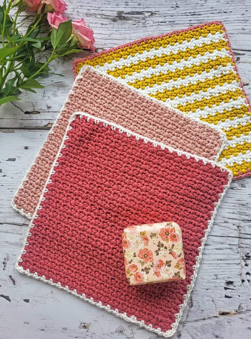 3 crochet washcloths and a bar of soap