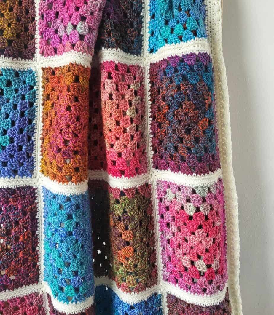 Closeup of the granny square blanket made with variegated yarn
