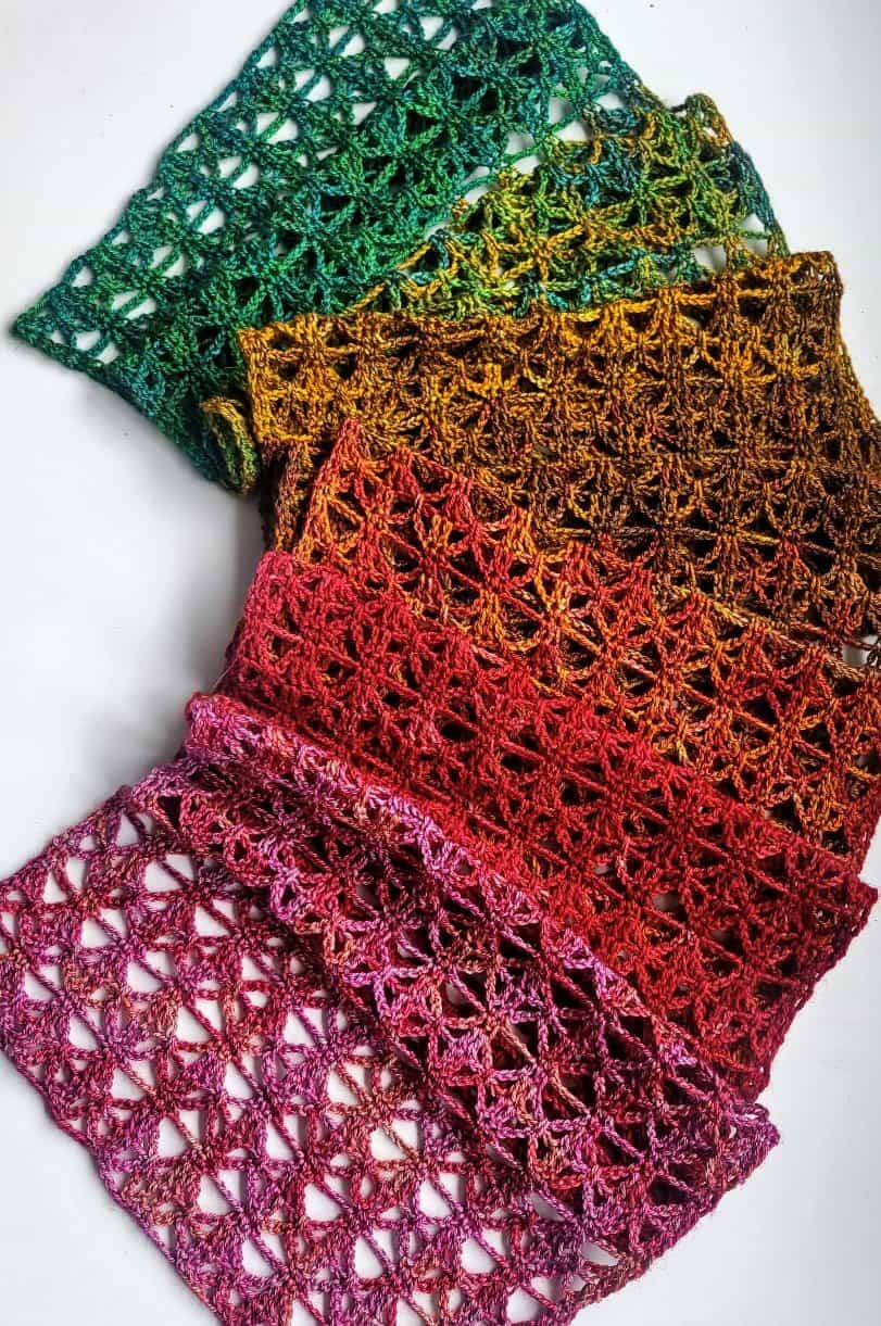 lace crochet scarf laid out on a white blackground