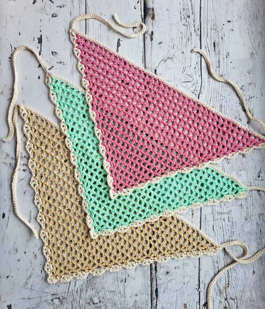 3 crochet bandanas in pink, green and beige with a lace border