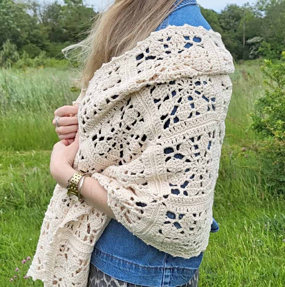woman wearing the Florette Crochet Flower Shawl draped over her shoulders