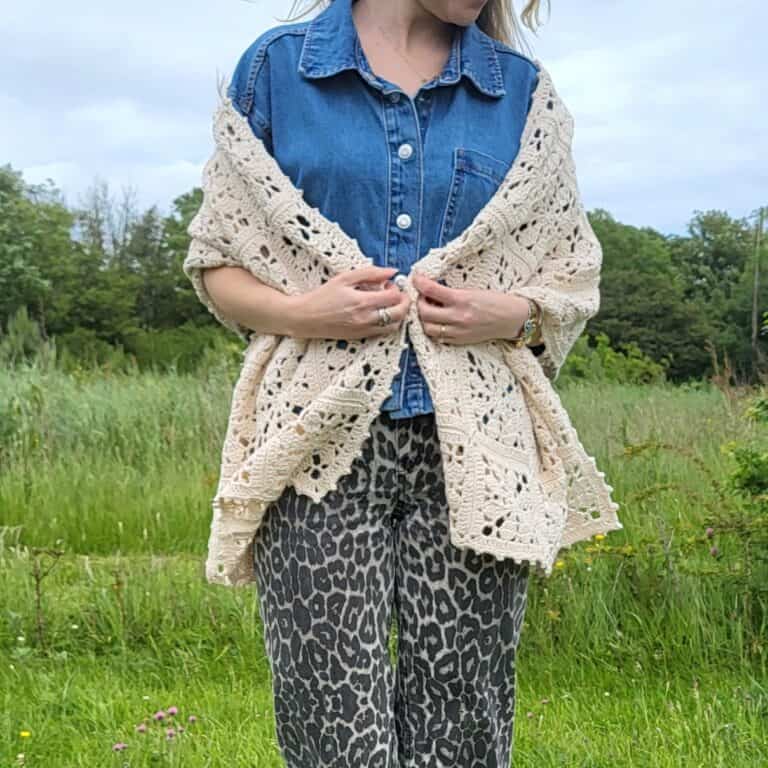 woman with the Florette Crochet Flower Shawl loosely draped over her shoulders