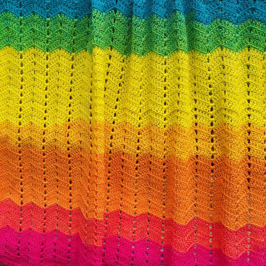 crochet ripple blanket in a rainbow of bright colors