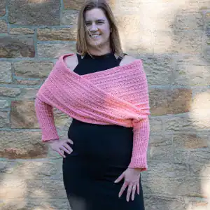 woman wearing a pink crochet sleeve wrap